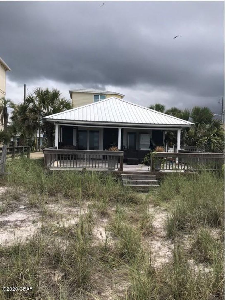 Great opportunity to own beachfront property at an affordable price! Additional detached parking pad is included in the price. Property sold AS-IS, some remodeling has been done but still needs work.