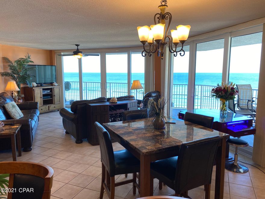 Spectacular Views from this Amazing 3BR / 2BA Dunes of Panama V End Unit!!!! One of the most popular floor plans on Panama City Beach, as you enjoy panoramic views from Not Only from the Living & Kitchen areas, But All Bedrooms too! This Fabulous unit has Tile throughout, but has really Accented the Beach feel with a wood style tile in the Bedrooms. New Black Kitchen Appliances & HVAC installed in 2019, New Hot Water Heater in 2020, Window in the Third Bedroom replaced in 2019 and All Sliding Glass Doors replaced in 2021. Plus, there is Granite counter tops in the Kitchen & Bathrooms, 70'' Flatscreen TV in the Master Bedroom and 50'' Flatscreen TV in the Living Room, Ring Doorbell, plus so much more!!!!! Not only will you Love this Condo, you will Love All the amenities that Dunes of Panama has to offer. Such as; Beach access, 3 Pools, Tennis Courts, Exercise Room, Shuffleboard, BBQ grills, Snack Shop & Market... just to name a few!!!!  Don't miss out, so schedule a showing today!!! All Dimensions are approximate and should be verified by Buyer if important.