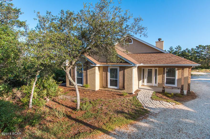 If you love to boat, fish, or kayak this is the perfect property for you! This awesome home sits on a lot 300 ft. deep, giving you tons of room to enjoy your backyard. Across the street is Lake Powell, and you're also just minutes away from the boat launch. This 3 bedroom, 2 bath home is move in ready and features new paint inside and out, new carpet, new AC, and much more. The floor plan is very open with high ceilings as well, making it feel very spacious as you walk in. If all this wasn’t enough, you’ll love that you’re less than 1 mile to the beach, 7 miles to pier park, and only 3.5 miles to 30A.