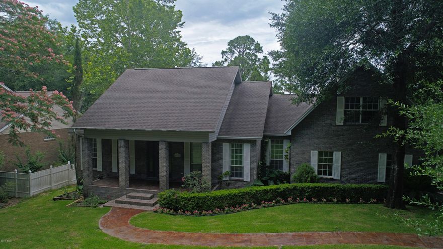 New on the market! Stunning Waterfront home with easy access to Deerpoint Lake and Econfina Springs, This custom built home has been completely renovated and is priced to sell. Enter in to 10' ceilings, recessed lights, and beautiful porcelain tile floors. Living space features a fireplace, breathtaking water views and access to 34x7 screened balcony. Perfect for entertaining. Kitchen boasts corian countertops, walk in pantry, and a brand new whirlpool appliance package. Formal dining and a breakfast nook, as well as breakfast bar open to living space. Plenty of natural light makes this home bright and airy. Split floorplan offers private master suite with a private balcony. Nice walk in closet and master bath features double vanities, Tile shower with his and her shower heads. and a Jacuzzi Tub. There are 2 additional bedrooms on the first floor and a full bath located between them. Both rooms are nice sized with nice closets. A half bath on the first floor is perfect for guests. On the second story there are two more spacious bedrooms and a full bath. One of the bedrooms has a private balcony that looks over the lake. There is a finished basement that is 575 sqft, it is poured concrete with a concrete ceiling. Making it a sound proof space that is perfect for a Theatre room or Man Cave. It has easy access to Garage and back patio and pool. Sparkling Pool with plenty of water views, Fire pit area. Excellent fishing right off the dock and plenty of birds and wildlife to watch. There is a storage building and oversize 2 car garage. A long custom driveway and sidewalk and plenty of beautiful trees. Home is prewired for surround speakers and outdoor speakers. Even has a central vacuum system. This neighborhood has underground utilities and no mobile homes are allowed. This home is truly a rare find. Schedule your visit today!