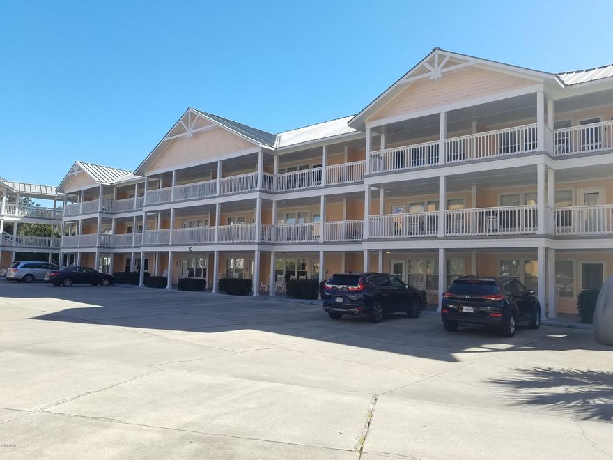 Looking for the PERFECT getaway to the Worlds Most Beautiful Beaches?? Well look no further because Here it is!! Very nice sought after 2 bedroom 2 bath with 962 sq. ft on the First Floor. Sip your coffee in the morning overlooking the greens on your back patio. In the evening rock in the rocking chairs on the front porch. This home will speak for itself with an open floorplan that is fully furnished! Just move right in or start renting out for the spring! The back patio has access from both bedrooms. The master bath has separate dressing area with double sinks. The ac, dishwasher & microwave is only 3 1/2 year old. The Washer and dryer are 1 year new! Custom made drapes in both bedrooms to keep the sun out while you vacation! There is plenty of parking in the parking lot. Peachtree Place II has  beautiful pool area, BBQ area. There is even an elevator to the top floors. The building only has 3 floors, so it is considered a low-rise and easy for financing. This home is priced to SELL so call today for your personal showing before this is GONE.....