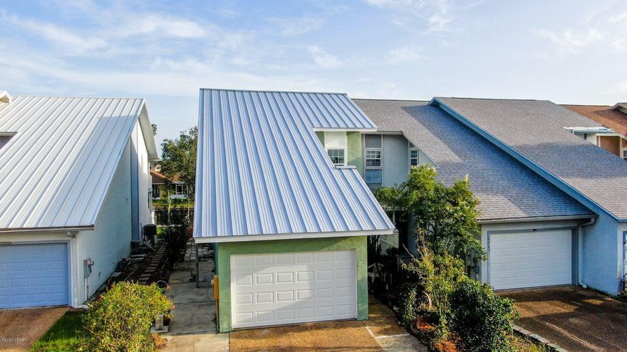 Beautiful, townhouse, 100% renovated after Hurricane Michael, stunning open floor plan, with new kitchen, new carpet, new paint, drywall, lighting, Metal roof, Home is on deep water canal and has a boat dock. Living room with wood burning fireplace, all bedrooms upstairs. House is being sold as is.