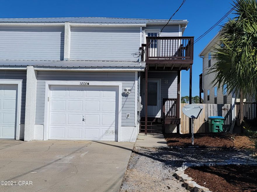 CURRENTLY UNDER CONTRACT, SELLER ACCEPTING BACKUP OFFERS.   This nice 2 story townhome is a short walking distance to the white sandy beaches.  This is a 3 bedroom, 2 bath home with single car garage. This would make a great family home or could be rented long term or as a vacation rental.  The first floor is open with living & dining, and the kitchen separated by breakfast bar.  Granite counter top with stacked stone backsplash, stainless appliances, and tile floors in kitchen and bathrooms.  There is a large utility room  off the back porch with washer & dryer hookups.  All Bedrooms are upstairs, and two have balconies. Privacy fenced backyard. Please measure if exact measurements are needed.