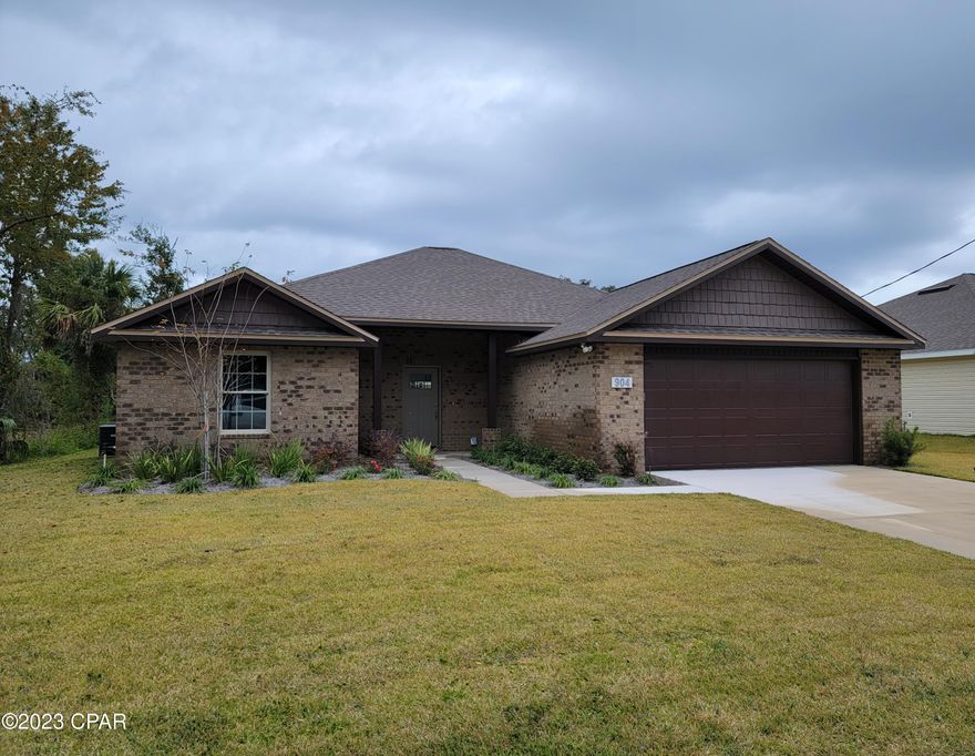 This LOVELY four bedroom two bath home is NOT in a flood zone and is located only a few blocks from Lynn Haven Elementary School.  It has a large kitchen with granite counter tops overlooking an open living area with raised ceilings.  Flooring includes luxury vinyl planking in the living and traffic areas.  Large main bedroom and bathroom with his and hers closet, garden tub, and separate shower.  This is a good living floor plan.  It has a sodded yard with separately metered sprinkler system.
