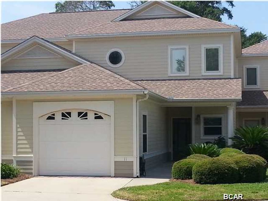 Immaculate well designed home with top notch construction that is close to 23rd Street shopping, Panama City Beach and hospital. This 3 bedroom 2.5 bath town home has a large screened porch that overlooks private Hentz Lake. Amazing ducks and shore birds frequent the lake and the magnificent oaks provide shaded privacy. Master suite is on the ground level and has a large seating area. The master bathroom has double vanities, his and her large closets with custom shelving, whirlpool tub, and a new decorator tile shower. The foyer has beautiful oak floors and leads to the spacious kitchen with top of the line cabinets, solid surface counter tops and is amazing in design and finish. The laundry room has a large sink and is adjacent to the powder room. Upstairs loft room is ideal for