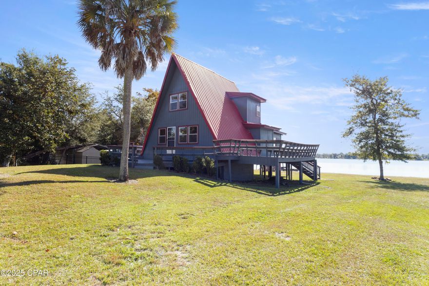 Discover an exceptional lakefront opportunity on Deer Point Lake. This well-maintained A-frame home sits on three waterfront lots in Bayhead Park and is designed for effortless lake living. The property offers 3 bedrooms, 2 baths, a finished attic ideal for extra guests or storage, a durable metal roof, and a spacious wraparound porch with integrated benches—perfect for relaxing or entertaining. Enjoy your private dock for fishing, swimming, and watersports, plus ample storage for all your gear and a convenient fish-cleaning station. Versatile and inviting, this home shines as a full-time residence, vacation retreat, family getaway, or high-demand short-term rental. A rare lakehouse opportunity with incredible lifestyle appeal. Schedule a showing today!