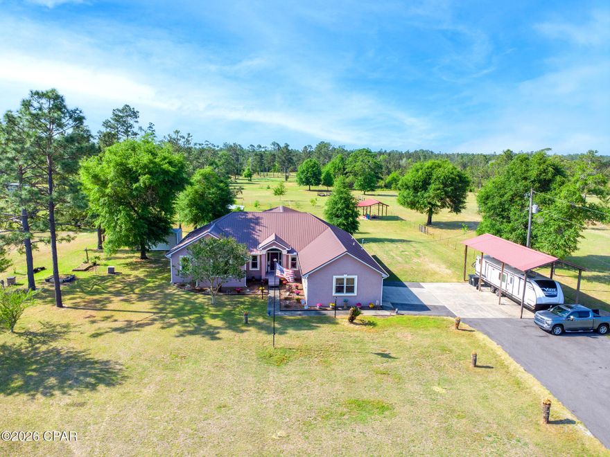 Set on 5 private acres in Fountain, this move-in ready 3BR/2.5BA stucco home with a versatile office and Bonus room, delivers the space, functionality, and freedom buyers are looking for. Inside, you'll find generous living areas designed for everyday comfort, while outside the property truly shines with established fruit trees and room to live, work, and play.

Built for versatility, the land is equipped with multiple outbuildings and pole barns, including a 36x40 pole barn behind the home, 22x24 pole barn, 16x36 pole barn with RV hookup and 50-amp service, a 20x24 powered workshop, and a 16x16 powered storage shed--ideal for equipment, hobbies, or recreational use.

Additional features include a durable metal roof, a 23 KW whole-home generator, and a whole-home dehumidifier system for year-round efficiency and comfort. 

Whether you're seeking a homestead, workshop space, or simply room to spread out, this property offers endless possibilities with the convenience of modern living. Don't miss your opportunity to own a true piece of Florida country living.