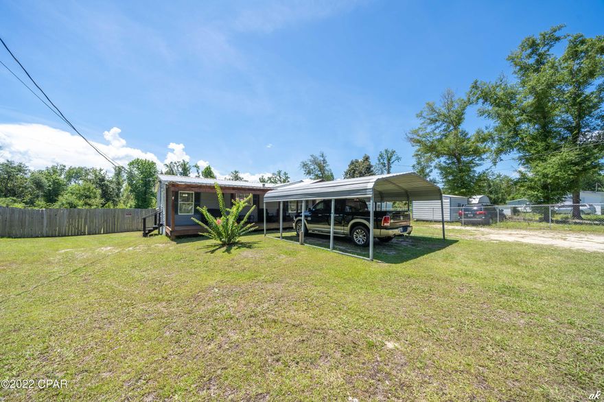 You really CAN live life on Easy Street. This 3/2 home features a split bedroom plan; relax inside and enjoy features including upgraded floors, new soaking tub, vanities, and showers, new range, upgraded countertops, and more. When you're ready to be outdoors, lounge on the generous front and back covered porches or in the ample yard. With over .7 acres to call your own, you'll love all the space, which includes a fenced backyard with plenty of room for cookouts and family gatherings. You'll be close to boating and fishing at Deer Point Lake as well as the Lynn Haven Bayou Park and Preserve--enjoy country living while still having easy access to the city. Buyer should verify all measurements if important. Call today for a personal tour to see all this one of a kind property has to offer.