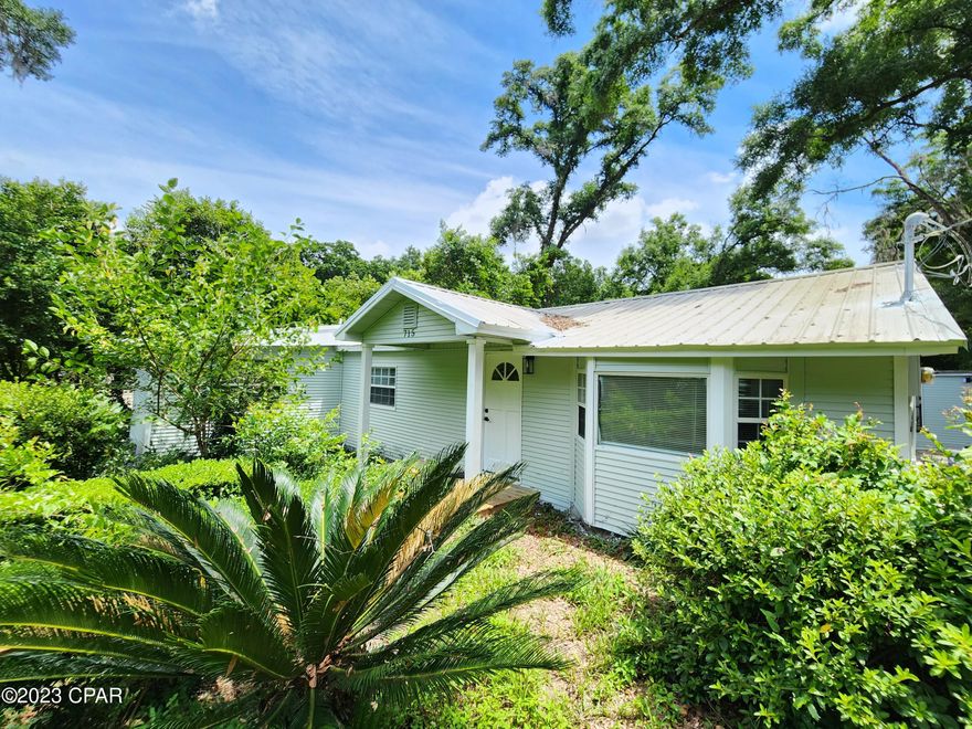 Welcome to your dream home in Tallahassee, Florida! This spacious 5 bed 3 bath property has undergone a complete transformation with upgrades in every room.  Sitting on a quiet street, as you drive up to this cute home you will fall in love! Step inside and be greeted by the bright and open living area featuring new LVT flooring that seamlessly flows throughout the entire home.  New kitchen. The AC is a professionally installed unit. NO HOA! Metal roof. There is an additional building that could be an office or a short term rental on FSU game days or graduation. Centrally located just off Woodville Hwy with easy access to Capital Circle, FSU or downtown, shopping, dining, recreation and more! Schedule your private showing today and fall in love with the flexibility Lewis Blvd S offers!