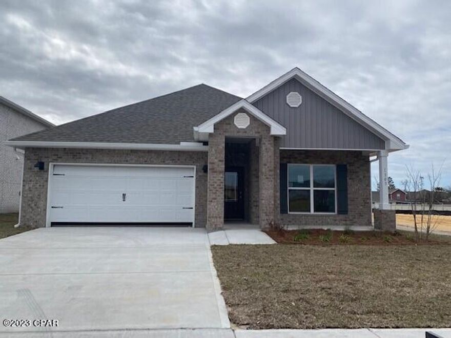 Andrews Park is centrally located off 389 in the very desirable area off Lynn Haven. Our Rhett floorplan is all brick, 4-bedroom 2-bath, it is an open concept floor plan, with a boasting 1,835 sq.ft.  The Rhett floorplan has upgraded finishes throughout. You will find 9-foot ceilings with 10-foot trays and beautiful crown molding. The Rhett also has LVP flooring, granite countertops, a large kitchen island with cabinetry on both sides underneath and brushed nickel hardware.  This floorplan has energy efficient windows to allow lots of beautiful natural light.  The primary bathroom has a beautiful garden tub, perfect for relaxing, and a spacious walk in shower with a glass enclosure. All of these homes come with Deako lighting and Safe Haven smart home systems. Andrews Park homes feature irrigation systems with reclaimed water to help minimize your water expenses. All homes come with a landscaping and sod package as well as gutters.