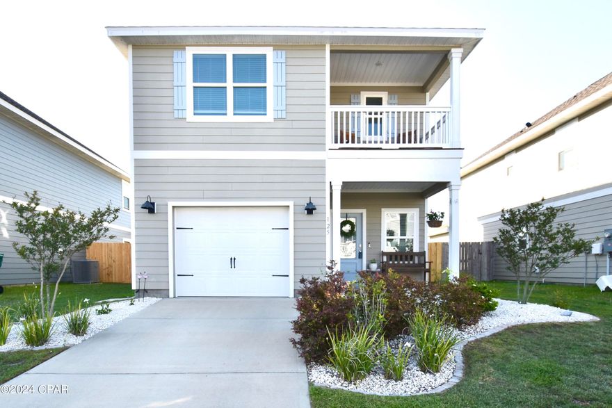 Stunning two-story Bridge Harbor home with views of Callaway Bayou!  Built in 2021, this home offers a blend of modern comfort with serene natural beauty, close to Tyndall Air Force Base, as well as shopping and entertainment.  Residents of this neighborhood enjoy access to a beautiful resort-style community pool, conveniently located a short walk away, providing a perfect setting for leisure and social gatherings.  
The home features three spacious bedrooms and two full contemporary bathrooms, plus an additional half bath on the first floor for your guests. 
This home offers a lot of natural light and the open concept living area is ideal for family time or entertaining. The kitchen features stainless steel appliances, a breakfast bar, ample cabinet space, a backsplash, granite countertops, and a built-in custom coffee bar, making it both functional and inviting.  A covered back porch is conveniently situated outside the dining area overlooking the spacious fenced backyard.  On the second floor, a charming front balcony off the Master bedroom provides a picturesque spot to enjoy morning coffees and evening sunsets, overlooking Callaway Bayou. The second floor also features the master bath, a laundry closet, full bathroom with a shower/tub combo and linen closet, as well as two additional bedrooms.
A Smart Home package with a keyless entry, video doorbell, automated front porch lighting, touchscreen panel, which can be integrated to control your lighting, thermostat, front door and more, are included.  
A one-car garage, complemented by additional driveway space, caters to your parking needs.
Call for your private showing to see for yourself why this is the perfect home for you - it won't disappoint! Measurements approx; verify if important.