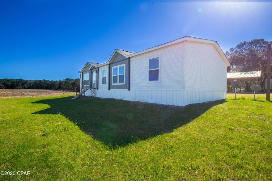 Incredible opportunity to purchase 19.67 acres located in the rural area of Vernon FL. This acreage is perfect for anyone looking for space, farming, etc. Located on the property sits a 1,568ft 3BD, 2BA 2020 built manufactured home with an updated interior, stainless steel appliances, and a spacious open floor plan which conveys on the land with the sell of the property. In addition this property also features a 32x60 open pole barn!