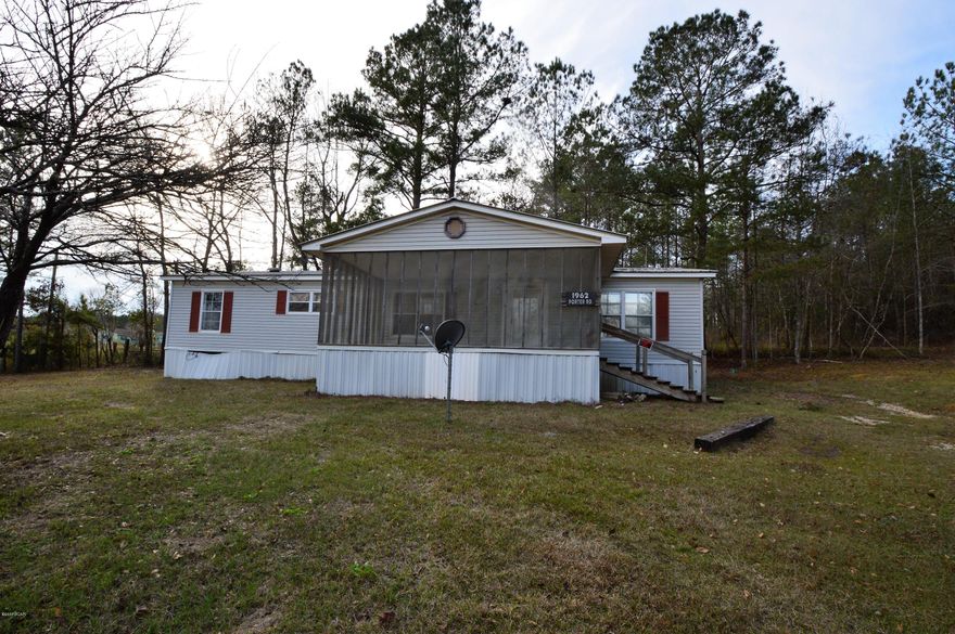 This two acre property is a hidden treasure.  This property features a large yard, as well as two septic tanks, and a well.  This double wide mobile home features three bedrooms and two bathrooms.  With some TLC this property could be a wonderful home in the country, while still having the convenience of being located near many main roads.