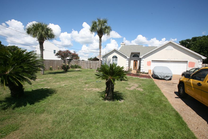 Beach Living at its best. Well established neighborhood, close to beaches, Pier Park, Hwy 79 but nestled along a quiet street, this home offers three bedrooms, two full baths, living room, dining room, large kitchen with breakfast bar with room for a table and chairs facing the bay window. Plenty of closet space, 10' ceilings. Swimming pool, and more..... Home in need of TLC, but after this will be a GEM.