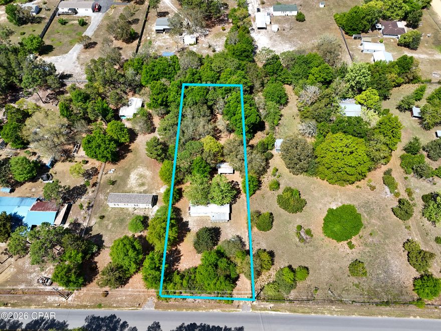 Discover the potential at 12535 Perkins Road in the peaceful community of Southport, Florida. This beautiful lot offers a great opportunity for anyone looking to build, invest, or create a quiet getaway. The property features an older 2-bedroom, 1-bath trailer that needs some work and a lot of love to make livable again -- or it could easily be replaced with a new home or mobile unit perfectly suited to your vision.  

The lot itself is the real highlight: spacious, serene, and ready to go with well, septic, and power already in place, saving you time and expense on setup. A shed in the back provides extra storage for tools, lawn equipment, or hobbies.  

Whether you're ready to build your dream home, bring in a new trailer, or invest in land with utilities already on site, this property has all the basics covered -- just waiting for your finishing touch.  

12535 Perkins Road - Country charm, quiet living, and endless potential in Southport, FL.