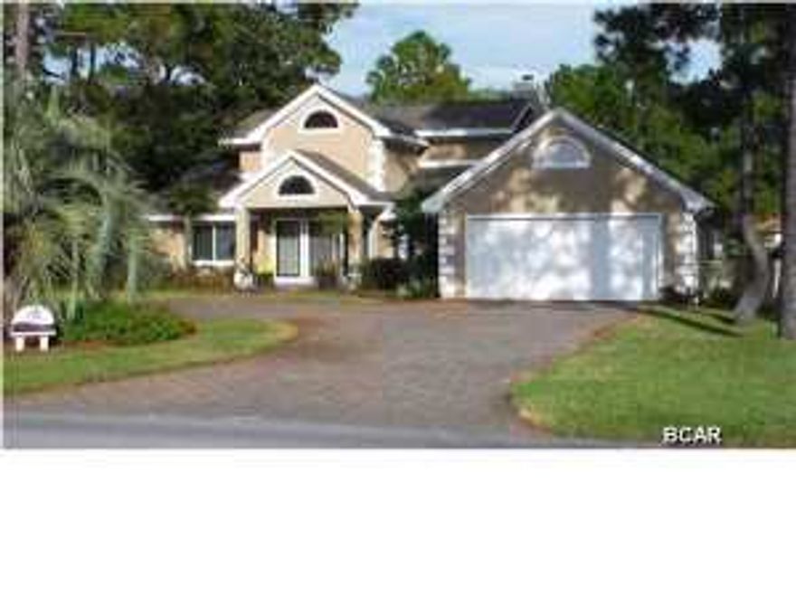 On a championship golf course in the prestigious gated resort community of Bay Point, this stunning 4 bedroom, 3 bath, residence showcases panoramic views of the pond and fairway. You are within walking distance to golf club 19 and the marina. This exquisite appointed home features a downstairs master suite, newly remodeled kitchen with new cabinets, granite and high-end stainless steel appliances. Other items updated, 30 year roof, new exterior paint/99 year energy efficient paint, hurricane & energy efficient windows, new sliders, new covered patio and screened lanai with a gorgeous salt water pool, new ceramic tile floors in kitchen, living room and dining room. New tank less, high efficiency hot water heater, and new paved stone circular driveway. Beautiful landscaping, well