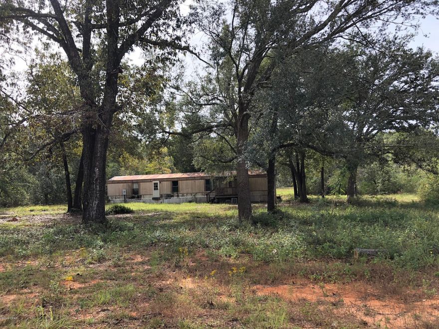 2.9 acres with well, septic, and power available on a level lot.  There is a 1983 mobile home  of no value that will need to be removed.  The owner is selling ''AS IS'', and will be buyer's responsibility  to remove the mobile home.

The Seller has not seen the property for few years and cannot warranty the condition of well and septic --will need to be inspected.

This is a nice lot for a home or mobile home package with beautiful trees and growth on it. Come take a look!