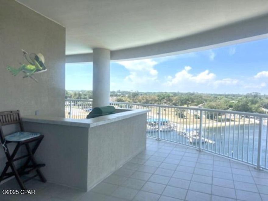 Available now for Lease. All utilities included! This fully furnished 3 bedroom condo boasts breathtaking 360° bay views from this corner unit in one of Panama City Beach's premier waterfront communities. Located on the desirable north side, this spacious condo features a massive 685 sq/ft wraparound balcony with a grill, outdoor bar, and stunning views — perfect for entertaining or relaxing.

Inside, the open layout includes a chef's kitchen with granite countertops, stainless steel appliances, island, coffee nook, and a pantry. The living room features floor-to-ceiling glass sliders, a custom wood accent wall, and an electric fireplace. A spacious master suite offers panoramic views, balcony access, and a luxurious bath with soaking tub, walk-in shower, and double vanities.

Two guest suites each have their own ensuite bath and bay views — one with a private balcony, the other with balcony access.

Amenities include, Infinity-edge pool & hot tub, fitness center, clubhouse, gated bayfront access, private pier and docks.  All housewares and linens are also included