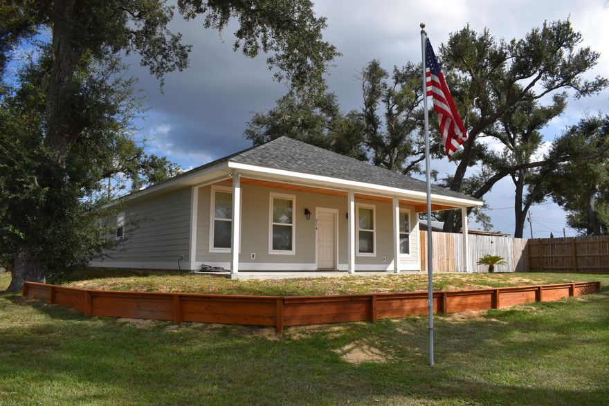 This house was built in 2019 which means its basically BRAND NEW & ready for YOU! Step inside, notice the cozy living area that flows into the quaint dining room with an island in the middle! The counter tops are TEAK butcher block, which coincide with the wood trim as seen through out the house. As you walk towards the back of the house you will find a laundry room which even comes equipped with a SINK! The master bedroom boast space and has tall trey ceilings, with a modern farm door leading into the bathroom with two vanity's, along with a walk in shower, and closet! Outside the master you will find a beautifully screened in porch perfect for outdoor gatherings! This house sits on a corner lot and is elevated. With a little imagination this house could be made into the perfect home!