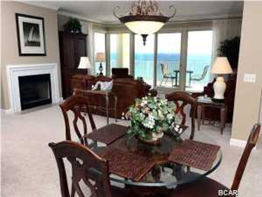 Absolutely fabulous * Grande Surf Club is a luxury building with incredible views of the Gulf coastline to the east and west * The serenity of this building is assured by only 2 units per floor * Imagine 2100 SF with 3 large Bedrooms and 3 full Baths * The very spacious kitchen has wood cabinets with corian counter tops, drop in glass stove, deep sinks, microwave, side by side refrigerator, large pantry, 2X2 custom tile floor and a large window overlooking the east end of the beaches * Great room with million dollar views. plush carpeting, gas fireplace and a incredible wrap-around balcony view, glass doors open to the 36' X 10' balcony * The master suite is luxurious with another fabulous view, sliding doors to balcony and walk in closet * Master bath has large whirlpool tub,