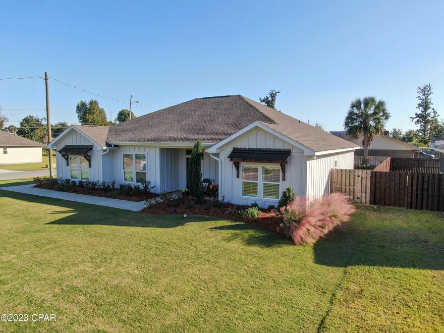 Welcome to your dream home! 

SELLER WILL PAY $10,000 TOWARD CLOSING COST, RATE BUYDOWN OR PREPAIDS.

Step into luxury and comfort with this stunning 4 bedroom, 2 1/2 bath craftsman-style home built in 2021. Every detail has been carefully designed, from the custom plantation shutters, exquisite 5-inch trim to the beautiful cabinets and backsplash that will take your breath away.

Experience the joy of open concept living, where family gatherings and entertaining friends become a breeze. Cozy up by the extra large fireplace on those chilly evenings, creating memories that will last a lifetime.  Matching Samsung smart IQ appliances make your chef experience amazing.  The living room is equipped with an 85''Sony HDR Ultra TV and audio equipment receiver with in ceiling mount Klipse speakers indoor and outdoor all professionally installed by Geek Squad. 

But it doesn't stop there! This incredible property also includes an outbuilding on a concrete slab, offering endless possibilities for storage or a workshop. And let's not forget about the meticulously landscaped yard, resembling the beauty of a golf course. Imagine waking up to this picturesque view every day!

Located in the highly sought-after neighborhood of Lynn Haven, just blocks away from the bay, you'll enjoy both tranquility and convenience. Drive way has room for RV or Boat and extra rebar reduces the chances of driveway cracking and are often laid out in a grid pattern. This enables them to resist the pulling forces of the concrete slab.  Don't miss out on this rare opportunity to own a piece of paradise. Your dream home awaits!  Oh did I mention...3.75 % assumable mortgage, balance approximately $319K.