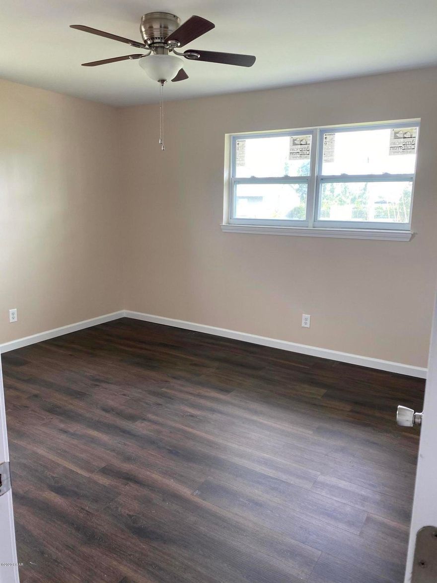 Move in ready! Cute exterior brick 2 Bedroom, 1 Bath home with the new roof (2019), new flooring, new windows, new doors and freshly painted interior walls, along with a two car detached garage space or with a little handy work it could be turned into a workshop. Must See.