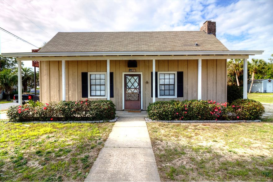 If you thrive on efficiency and the warmth of wood, this could be your cozy cottage one block from the beach. The sandy beige board and batten exterior, covered porch along the front and towering stone fireplace create a quaint appeal that is carried over the moment you step inside. New laminet floors sport the radiance of wood grain in multiple shades of deep amber and light dusty browns. A charming slate fireplace flanked by built-in bookshelves creates a focal point and rustic cabin feel not commonly found in this Laguna Beach neighborhood. The kitchen is efficiently organized along the outside wall with the requisite window over the sink, an attractive tile floor and generous breakfast bar and work space. One of the dining counters is bar height, and the other is normal height, perfect for little ones, craft projects, home office space or homework corner. Two bedrooms and baths are neatly tucked into this gem, with a third sleeping area and full bath on the second floor. Privacy in the back is accentuated by artistically gnarled, indigenous tree trunks and native vegetation. It's a charming little paradise with an outside entrance to the lockout second story.