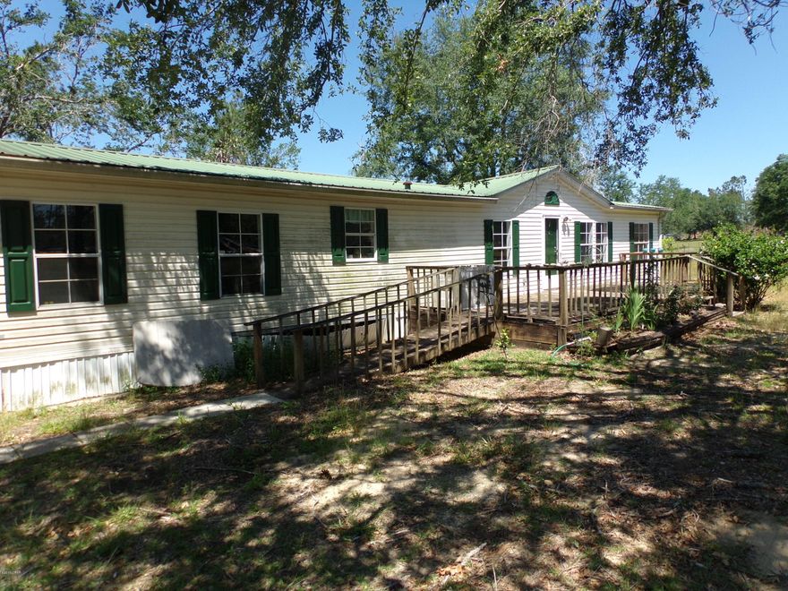 IF YOU ARE LOOKING FOR A MOVE IN READY HOME IN THE COUNTRY LOOK NO FURTHER! SPACIOUS BACK DECK TO GRILL OR WATCH THE SUN SET! THIS HOME  HAS A METAL ROOF AND FRESH PAINT ON THE INTERIOR!  WOOD BURNING FIREPLACE IN DEN, ISLAND IN KITCHEN WITH BRAND NEW TOP! TWO STORAGE SHEDS INCLUDED. COUNTRY LIVING AT ITS BEST WITH A SHORT DRIVE TO THE BEACH!