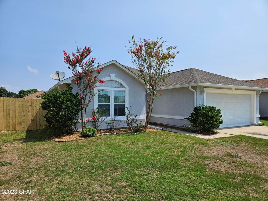 'CURRENTLY UNDER CONTRACT, SELLER WILL CONSIDER BACKUP OFFERS'Looking for a 4 bedroom beach house? Motivated seller facing health issues and desires a quick sale. This remodeled, move-in ready home just off Thomas Drive is only about 4 miles to the World's Most Beautiful Beaches. It has plenty of room with 4 bedrooms, 2 bathrooms and a 2-car garage. It was totally remodeled in 2022 with kitchen granite countertops, tile back splash along with top of the line appliances. The natural gas fireplace in the living room can help on those chilly nights. The large yard had a sprinkler system installed in January 2022. The living room and master bedroom feature tall ceilings. Washington oak luxury vinyl planking 3/8 inch thick is throughout the entire house. The AC system and water heater replaced in 2019 along with the 30-year roof. French doors lead to a screen lanai to enjoy the evenings and meals. A 10x20 wood deck is just off the lanai. Ceiling fans are in all 4 bedrooms and living room. A new wood privacy fence was installed in the fall along with new gutters and down spouts.