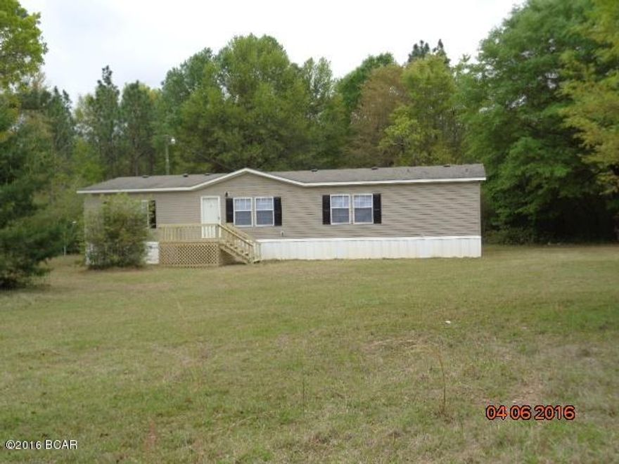 REDUCED--REDUCED-----IMMACULATE SECLUDED COUNTRY HOME W/ GOURMET KITCHEN. HAS  S. STEEL COMMERCIAL REFRIGERATOR, MICROWAVE, SMOOTH TOP STOVE,AND DISHWASHER. 2 BREAKFAST BARS W/ISLAND, HANGING POT RACK,DESIGNER LIGHTING WITH LOTS OF COUNTERS AND STORAGE. HOME HAS OPEN FLOOR PLAN WITH KITCHEN IN CENTER BETWEEN 16X15 LIVING ROOM AND 15X20 GREAT ROOM. THERE IS VINYL IN KITCHEN AND LAMINATE FLOORING IN THE STEP DOWN GREAT ROOM. CROWN MOLDING THRU OUT. THERE IS A SPLIT BEDROOM PLAN, WITH MASTER BATH HAVING A DOUBLE VANITY, SEPARATE SHOWER AND GARDEN TUB. THE HOME HAS NEW CARPET AND NEW PAINT. THERE IS APPROX. 20'X30'POLE BARN, WITH APPROX 1.5 ACRES CLEARED, BALANCE IS ALL WOODS, MOSTLY FENCED AND ON A PAVED ROAD.- FINANCING  AVAILABLE  WAC -  SEE ADDITIONAL COMMENTS ---- THERE ARE SEVERAL TOP RATED SCHOOLS IN THE AREA,  ANTIOCH ELEM, HOBBS ELEM, AND  MILTON HIGH.  THE UNEMPLOYMENT IS  4.7 IN THE AREA.  THE 4 TOP RATED JOB OPPORTUNITIES ARE, CONSTRUCTION, RETAIL TRADE, HEALTH CARE, AND  PUBLIC ADM/ EDUCATION.   SHOPPING IS ONLY MINUTES, WITH PENSACOLA  AND GULF COAST BEACHES 30 MIN TO 1 HOUR.  HOME HAS LOTS OF AMMENITIES AND POTENTIAL,  BUT IS READY TO MOVE IN.   -- BEST OF ALL THERE IS FINANCING AVAILABLE  WAC  ---  CALL FOR YOUR APPT  TODAY !  THIS ONE WILL NOT LAST LONG