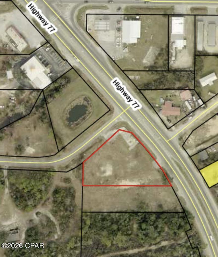 ±1.15-acre commercially zoned (C3) corner parcel located along the highly trafficked Highway 77 corridor in Southport. Positioned at the corner of Hwy 77 and Hwy 2321, the property offers direct ingress and egress, strong visibility, and exposure to approximately 29,000 vehicles per day.

This parcel serves as the primary access point for the adjacent interior lot at 7401 Hwy 77, creating an opportunity for expanded development when combined. Ideal for auto-oriented, retail, or quick-service commercial uses seeking high-traffic exposure.

Available individually or as part of a ±1.95-acre assemblage.