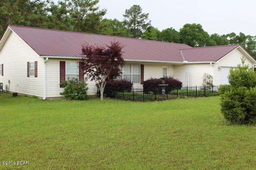 Beautiful home on 1.97 acres! This 2006 built home has 3 bedrooms & 2 full bathrooms. You'll love the open floorplan with vaulted ceiling and hardwood floors. Kitchen has a pantry and island, and then French doors out to the lovely backyard.  The master bedroom is spacious and has a walk-in closet & private bathroom w/ double vanities & Jacuzzi tub. This home also has a large laundry room, 2 car garage, & extra outbuilding.