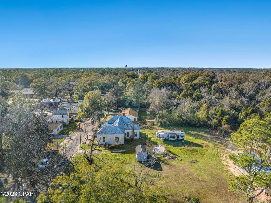 Charm and character abound in this historic DeFuniak Springs home! Built in 1935, this spacious 2,068 sqft. corner lot home is a fixer upper waiting for its next owner to bring it back to its former glory. With 0.67 acres of land, there's plenty of room to add your own personal touch. The owner has started renovations, but with a change of plans, it's time for a new vision to take over. Bring your tool belt and creativity and turn this home into the gem it was meant to be. Don't miss your chance to own a piece of history in beautiful DeFuniak Springs! Cash transactions only.