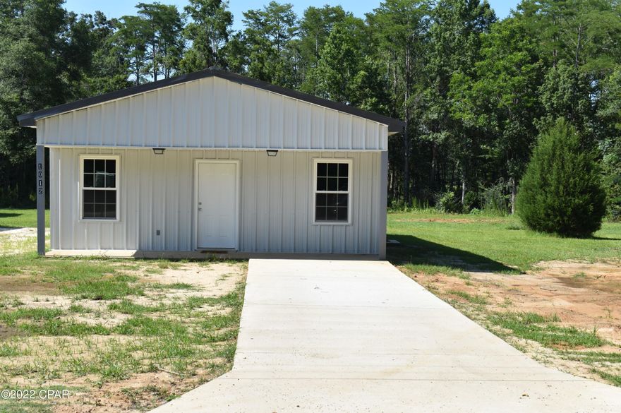 Construction has just begun on this Energy Efficient home which is being constructed with all steel framing on interior & exterior. All metal is eco-friendly & is 67% recycled. It features a metal roof, metal siding, side by side refrigerator with water & ice maker, central heat/air with heat pump, an electric On Demand water heater, Whirlpool appliances & stained concrete floors. Home meets all current Florida building & energy codes and qualifies for some of the lowest insurance rates in our area! Home features include a 14 x 15 metal outbuilding, spacious front porch, a concrete parking pad with sidewalk & side entrance for convenient unloading of groceries into the kitchen.