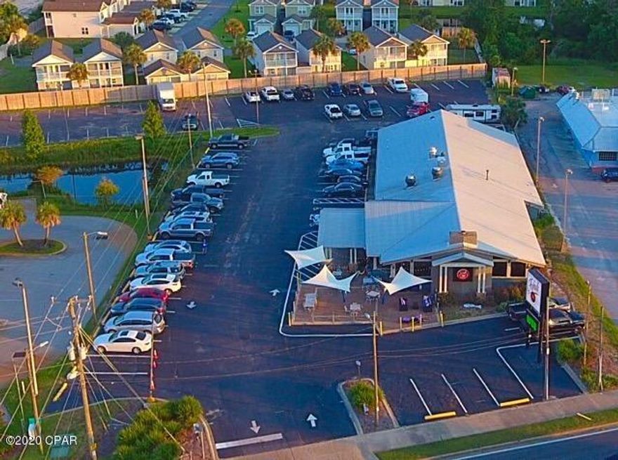 Turnkey restaurant for sale!! Owner has successfully operated the restaurant for 25 years and is looking to retire. Great oportunity! Property is zoned C-3and is 1.87 acres with 225 ft frontage on Front Beach. Close to new PCB Sports Complex. Site can also be used for retail and would also lend itself for redevelopment as hotel/motel space. 25,200 traffic count.  Building has been well maintained for future owners!