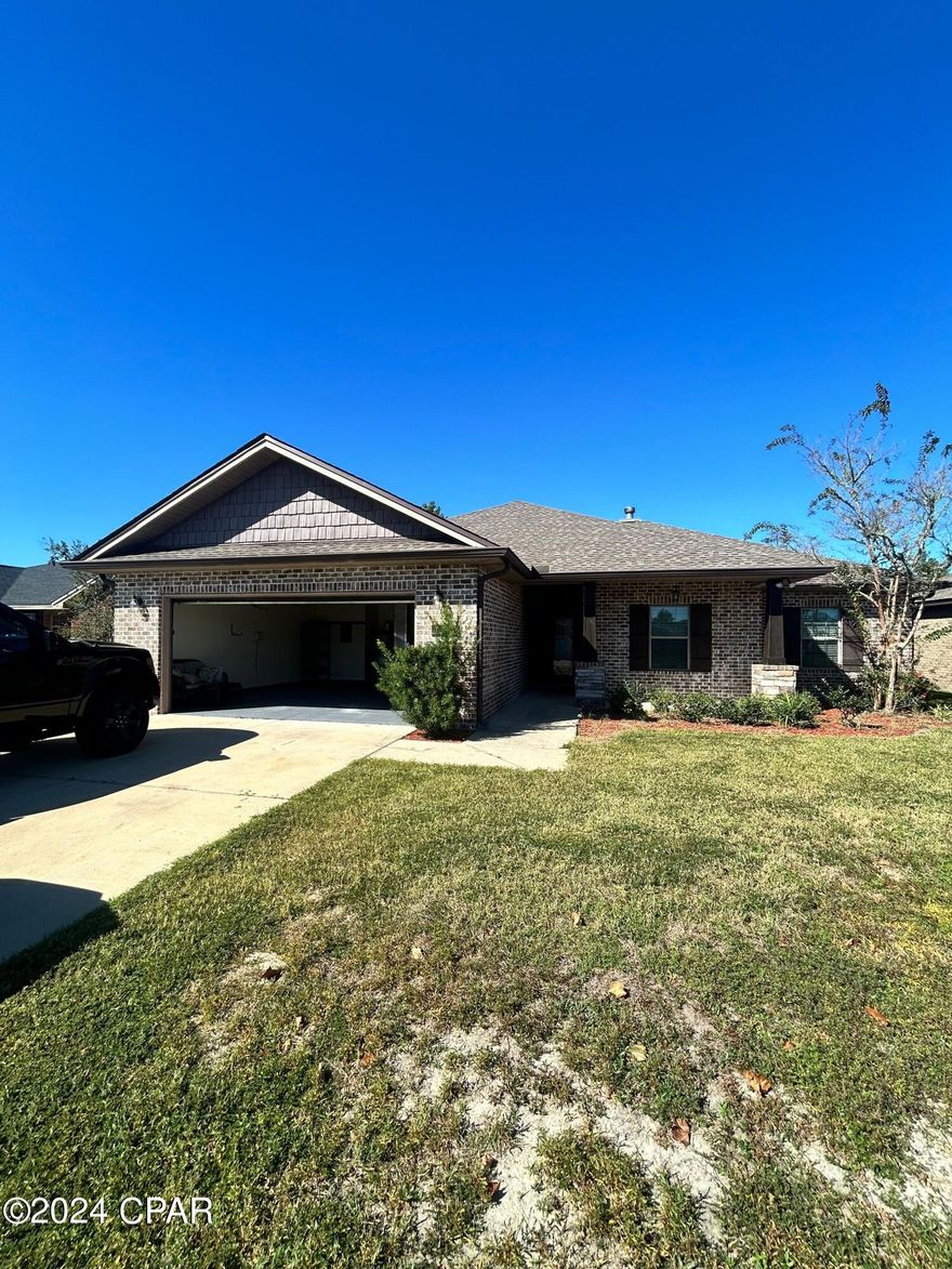 This stunning 4 bedroom, 2 bathroom home located in Panama City, FL. This house features tile flooring throughout, a beautiful stone fireplace, and a spacious kitchen perfect for entertaining. The living room boasts wood flooring, adding warmth and charm to the space. The master bedroom includes a luxurious soaker tub with jets for ultimate relaxation. Step outside to the outdoor entertainment area, complete with a large deck perfect for hosting gatherings. With a two car garage and a breakfast bar, this home has everything you need for comfortable living. Don't miss out on the opportunity to make this house your home.