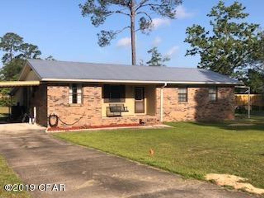 This 3/2 brick cutie, located in the city limits of Chipley, won't last long! Home has had some updates, newer metal roof, some new flooring, newer interior paint. Inside features include dining room open to kitchen, large living room with  additional oversized bonus/family room, full bath in master bedroom and spacious laundry room that walks out to carport. Outside features include back deck that is perfect for entertaining, additional carport for car/boat/lawnmower and paved driveway. Call for your personal viewing today!! 

**New carpet will be installed in Bonus/Family room, hallway and bedrooms before closing. Along with wood door casing/trim work being finished out.**