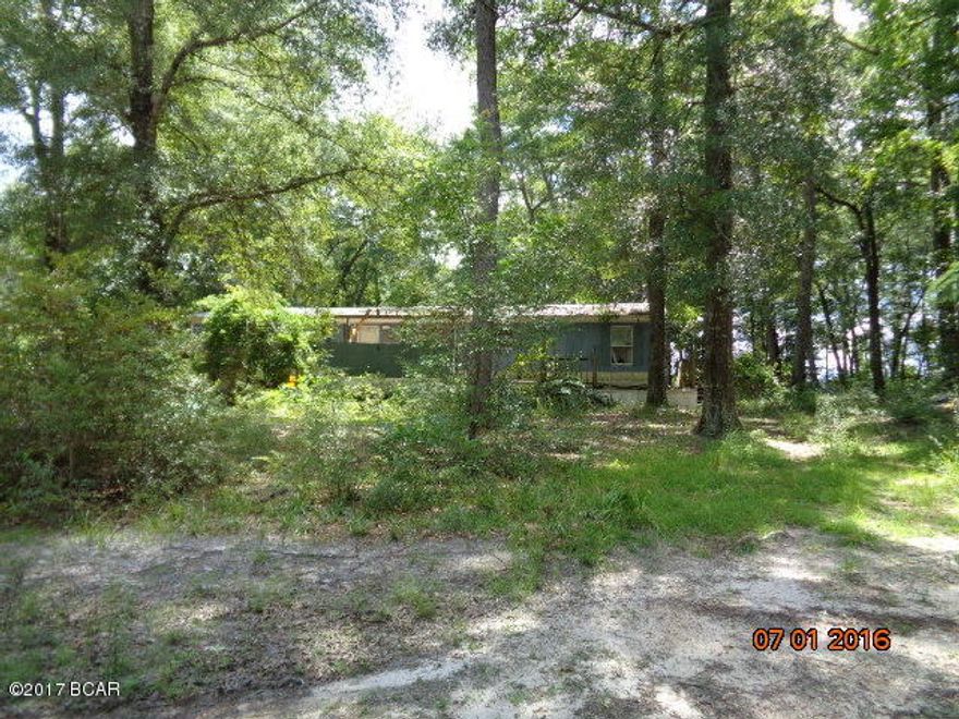 HOME IS A TOTAL TEAR DOWN,  THERE ARE NO TITLES TO THE PROPERTY.  1.06 ACRES
