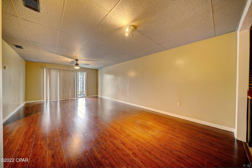 2 bed, 2 bath condo at Bay Club Condos! Short term rentals are allowed! This complex is located in the highly desired Cove neighborhood. This peaceful condo sits across the street from the Bay and features a Bay front pool and a sitting area with swinging beaches. Beach Drive is just a few steps away and offers a gorgeous scenery for evening walks. This condo has been recently updated with many upgrades such as wood-look tile flooring, new ceiling fans, bathrooms and kitchen. The living room is spacious and features sliding glass doors that lead to your private patio. The kitchen is equipped with stainless appliances, butcher block counters, backsplash and dark color cabinets.  The spacious primary bedroom features a large closet with hook-ups for a stackable washer/dryer and also features private ensuite. The primary bathroom boasts surround tile throughout including the walk-in shower. The shower features an upgraded shower head and a glass door. The additional bedroom is spacious and shares the full guest bathroom. The guest bathroom also features surround tile throughout. The shower in the guest bathroom also features an upgraded shower head and a glass door. This condo is located near schools, parks, restaurants, coffee shops, shopping including boutiques, and more! Check out this condo today!