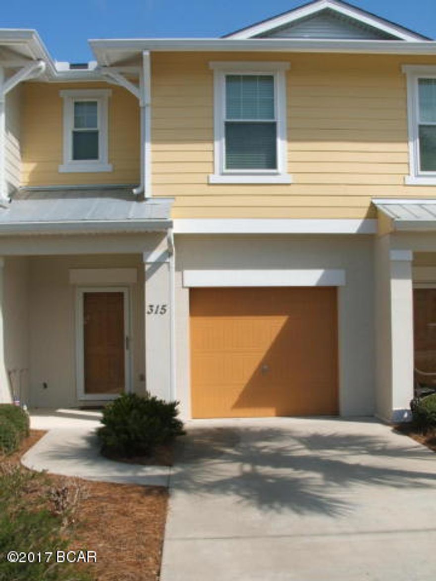 Located a few miles from Pier Park, Whisper Dunes is one of the finest communities on the west end of Panama City Beach. This 3 bedroom 2 1/2 bath unit has upgrades including 18x18 tile floors on the first floor, granite counter tops with tile back splash in the kitchen, and a screened back patio which boasts a great view of the conservation area. There is plenty of storage with nice closet space and a very large walk in closet in the master. A full size garage and the community has a great pool are to enjoy! In addition, the HOA fee takes care of outside maintenance to the residence such as roofing, painting, landscaping, power washing every 2 years.