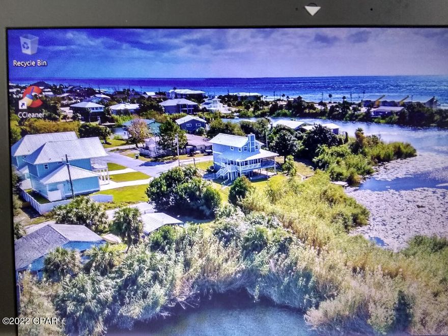 Beautiful Vacant Lakefront Lot just a block from the Gulf- 50X80 4000 SF 

100 ft of retaining wall on the lake with water meter set and impact fee paid

Septic traffic tank (can drive over) and field are installed but have been told city sewer is being brought in around the block.

Current survey available

Short / Long term rentals allowed

Golf cart friendly community.