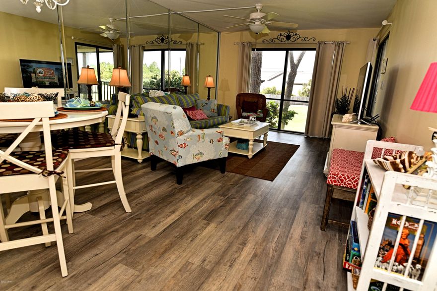 Updated, pretty 2nd floor Villa with tranquil golf course view of Hole 3. Modern kitchen featuring granite, stainless, raised ceiling. New AC. Beautiful easy care wood flooring, wainscoting accent. Spacious with a private balcony full of coastal breezes and sounds of the surf. Large Bedroom with it's own bathroom. Nice furnishings and decor - ready to earn rental income - 2019 Gross $25,200. Pet friendly for Owners! Steps to heated Villa pool. The beachfront amenities are a short walk or tram ride away: Beach Access, Tropical Pools, Hot Tubs, Sun Decks. Restaurant, Poolside Bar, Market, Pizza Shop. Kids Club with Splash Pad, activities. Owners play UNLIMITED Golf, Tennis, Shuffleboard. Fitness Center, Salon services. Gated Entrances, 24-hr Security. Walk to dining, entertainment, shopping