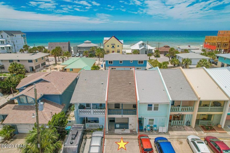 CURRENTLY UNDER CONTRACT, SELLER WILL CONSIDER BACKUP OFFER. Amazing Gulf-View Townhome, on the South-Side (gulf side) of Thomas Drive, and 200-Feet to the Sugar-White Sand and Emerald-Green Waters.  This has been used as a primary home but would be an amazing rental based on its location and there is no HOA, so no HOA fees!  Vacation rentals are allowed in this community. Featuring 2 bedrooms, and 2 ½ baths, the upper floor consists of the living room with a private balcony with a view of the Gulf-of-Mexico.  Imagine each morning sitting on your private balcony, sipping your coffee, and taking in the beautiful sea breeze.  The living room is open to the dining area, and the kitchen features brand-new stainless-steel appliances (never used) to include a refrigerator, stove, dishwasher, and range hood.  There is another covered porch off the kitchen, as well as a half-bath.  The downstairs features the master bedroom with private access to the covered porch, leading to the fenced in backyard, and also has its own private bath. The 2nd bedroom is toward the front of the home and also has its own private bath.  This home has a wonderful floor plan and feels larger than 1204 sq.ft.  There is a separate laundry area on the first floor and the sellers are leaving the washer and dryer.  The lower front porch also has a separate 6x6 storage closet, which makes it easy to store all those beach chairs and toys. This home is truly walking distance to the beach but is not located in a flood zone.  The backyard is completely fenced in, making it a blank canvas for you to create your own backyard oasis. If you have ever wanted an affordable beach home, this is the home for you.  Additional features include: Roof replaced 2019, Reem water heater replaced 2022, both sliders-upper/lower were recently replaced, the windows in the front upper and lower were recently replaced, all stainless steel kitchen appliances are brand new, fenced in backyard (fence belongs to sellers), sprinkler system, outside shower, gutters, outside storage in both the front and back, and this home has been hooked up to city sewer and water, and has a lift station.  If you are not familiar with this location, Hispaniola is on the east end for added privacy and minutes to St. Andrew State Park, yet walking distance to restaurants (Schooners, Patches, Newbies), and minutes to bars, restaurants, and area attractions.  You cannot beat this location and if you plan to rent, your renters will always have something to do. If this sounds like the property you have been waiting on, set up an appointment for a private showing before your dream of owning a piece of paradise becomes someone else's realty.  Age, Sq.Ft., Schools, dimensions, taxes, or any important information is an estimate only and mut be verified by the buyer if important via a personal or professional inspection.