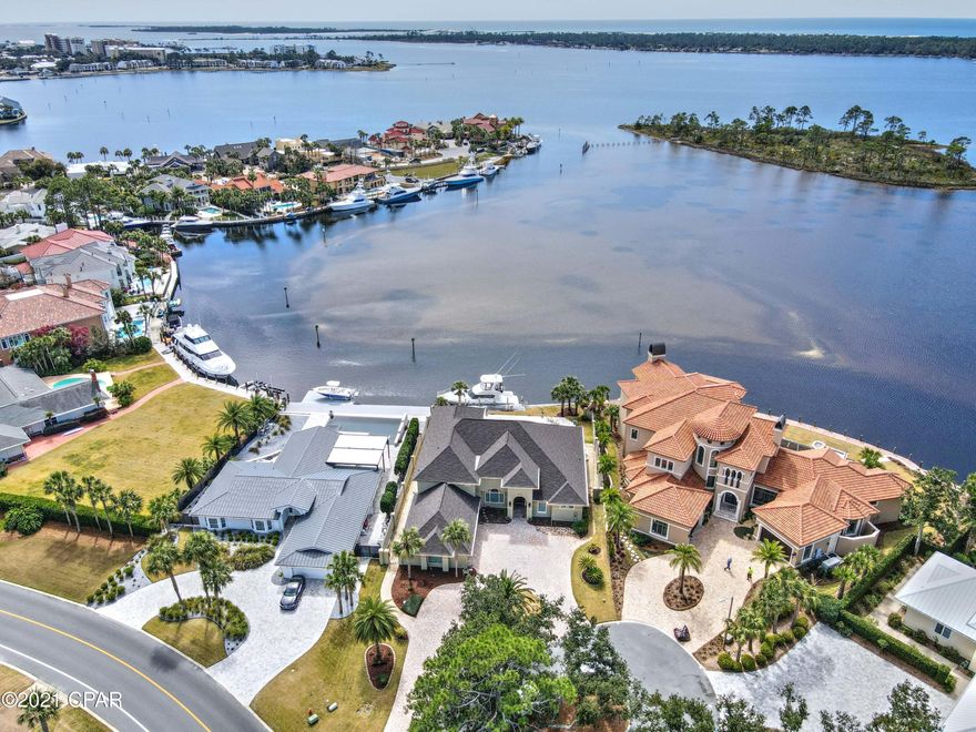 CURRENTLY UNDER CONTRACT, SELLER ACCEPTING BACKUP OFFERS. Waterfront home in Bay Point, east of the bridge and 90 feet on DEEP WATER - perfect for your yacht & water toys! Relax and take in gorgeous Grand Lagoon views from your spacious covered patio, pool, and hot tub.  Featuring 4 bedrooms and 4 baths, enjoy the perfect floor plan with almost all rooms on the main level, including the master bedroom and office. Open kitchen, butler's pantry, tall ceilings,  ample storage, and a view from every room!  Great curb appeal, 3 car garage, new roof, 3 HVAC systems , new hot water heater, a second instant gas hot water heater for the master, pool just resurfaced, updated kitchen and brand new master bath.  Call today - this literally checks all the boxes of waterfront simple elegance.