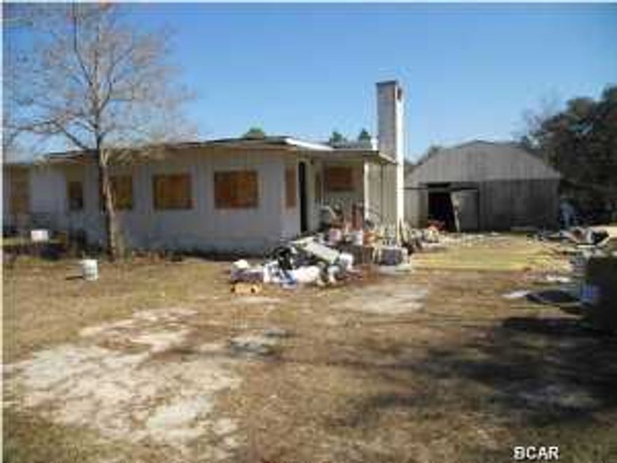 * BANK OWNED * LAND HAS 2 ACRES AND HOME HAS NO VALUE AND IS TOTALLY TRASHED. PLEASE DO NOT GO INSIDE AS THE INTERIOR IS TOTALLY DEMOLISHED AND BROKEN GLASS AND DEBRIS EVERYWHERE. ENTER AT YOUR OWN RISK. ONE ACRE LOT RECENTLY SOLD FOR $35K ON S. HOLLAND(mls#623839). The Holland Rd neighborhood is just off the beaten path, making it comfortable to live on a road with mostly local neighborhood traffic. This location is perfect for really close access to Deer Point Lake that features lake front picnic area and a boat launch. Plus being just a short distance to Deer Point Dam, you have the best of both fishing worlds with salt and fresh water fishing across the road from each other.