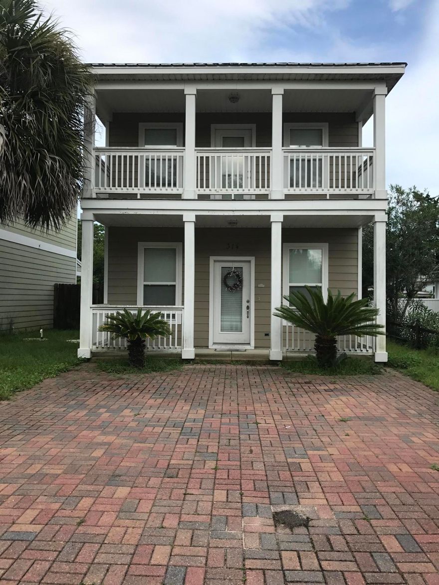 From the road in front of this 2 story beach home, it's not a mirage; it's the waters of the Gulf. All you have to do is start walking and you will be there within a few minutes. Or for the drivers out there, take your golf cart with all your beach gear and start driving south. The brick paved driveway adds to its character too. Den & Kitchen downstairs; two bedrooms upstairs.Master bedroom has large covered balcony overlooking the quaint little street.