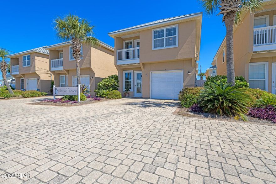 Lovely single family home on Thomas Drive, is just steps from the gulf!  This three bedroom, 2.5 bath home has been completely remodeled, and beautifully decorated and furnished and offers stunning views of the gulf.  A shared pool sits off of the living room.     The kitchen offers new cabinets,  granite countertops and stainless steel appliances.  Great location for short term rental and even comes with an attached garage.  Every detail has been thought of in this home.