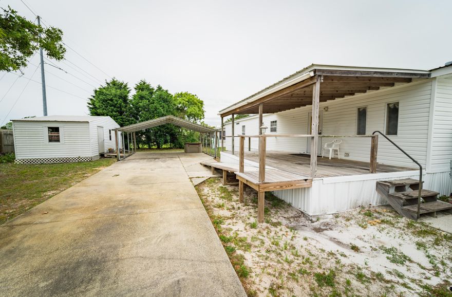 Property is currently under contract But seller is taking back up offers .Very nice & large doublewide mobile home on an oversized (80x128),corner lot in Laguna Beach. This home offers so many wonderful features including the bright and airy open floor plan, the living area with a wood burning fireplace, the kitchen has a breakfast bar and both the kitchen and living area open to the nice dining area. The master bedroom has a great walk in closet and the master bath has a garden tub and a separate shower. This home has the popular split bedroom floor plan. The outside of the home is very impressive. It boasts a wired and shelved work shop, 2 large carports, 2 parking pads, 2 large decks, the back deck is covered and the front deck is open and sunny. Only a few blocks to Laguna beach.