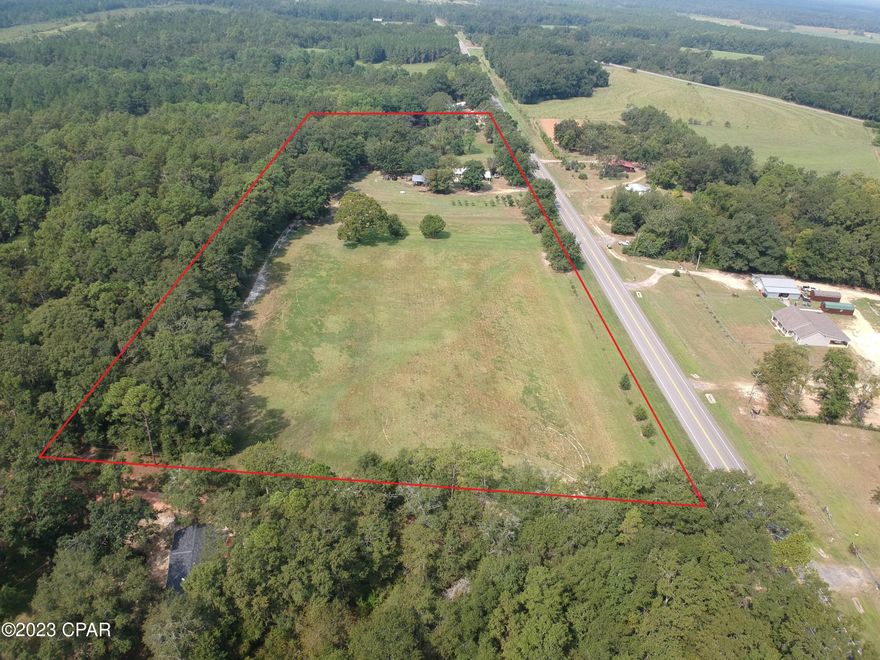 ''Home on 10 Acres with a pond'' Large 40x28 Pole Barn and a 1404 sq. ft. barn.  This would be a great small farm with cleared pasture land or just an investment property. It is a Triplex home with 2 bedrooms and a full bath on the first level with a large walk in closet. You step up into the next level into the kitchen and dining area and walk into a nice den area. The bottom level of the home has two bedrooms, bathroom and a laundry area. Blueberry and Loquats trees are on the property. Schedule a showing to see this property today.