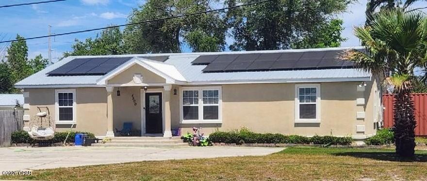 Welcome to this well-maintained 4-bedroom, 3-bath home offering over 1,900 square feet of versatile living space with a desirable split floor plan. Don't let the exterior fool you--this home opens up into a spacious and functional interior that feels larger than expected. The layout features three bedrooms on one side of the home, while the primary suite and additional office/bonus room are privately situated on the opposite side--perfect for added privacy and flexibility.

As you enter the home, you're welcomed into a spacious living area that flows seamlessly into the dining space and kitchen, creating an open and functional layout ideal for both everyday living and entertaining. The thoughtfully designed layout maximizes every square foot, offering functional living space with no wasted areas. The interior features textured walls for a more finished look, along with updated vinyl plank flooring.

The kitchen offers ample counter space, a pantry, and stainless-steel appliances, while a large laundry room adds extra convenience.

The spacious primary suite includes a large walk-in closet and an en-suite bathroom featuring double vanities, a walk-in shower, soaking tub, and a private toilet closet.

A standout feature of this home is the rear bedroom with its own full bathroom and private exterior entrance--ideal for guests, extended family, or potential rental income.

Major updates provide peace of mind, including a metal roof and a fully replaced HVAC system within the past 3 years, along with fresh interior paint.

Situated on a desirable corner lot with a city park directly across the street, this home is conveniently located just minutes from the Hathaway Bridge, Florida State University Panama City, and Gulf Coast State College. Enjoy quick access to St. Andrews Bay with nearby boat ramps and waterfront recreation.

The fully fenced backyard features a 21-ft above-ground pool with partial in-ground installation, a surrounding deck, additional back deck space, and a large 25x10 enclosed shed. The property also offers ample parking for up to 6 vehicles, including space to accommodate a boat or trailer--perfect for enjoying the nearby water access.

The home also includes an installed solar energy system, offering long-term energy efficiency and consistent power costs.

This home offers space, flexibility, major updates, and an excellent location--ready for its next owner to make it their own.